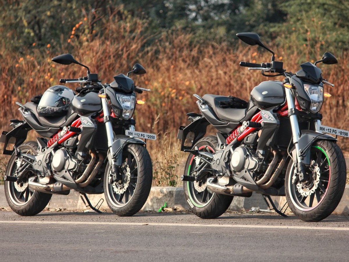 Motorcycles parked beside a road